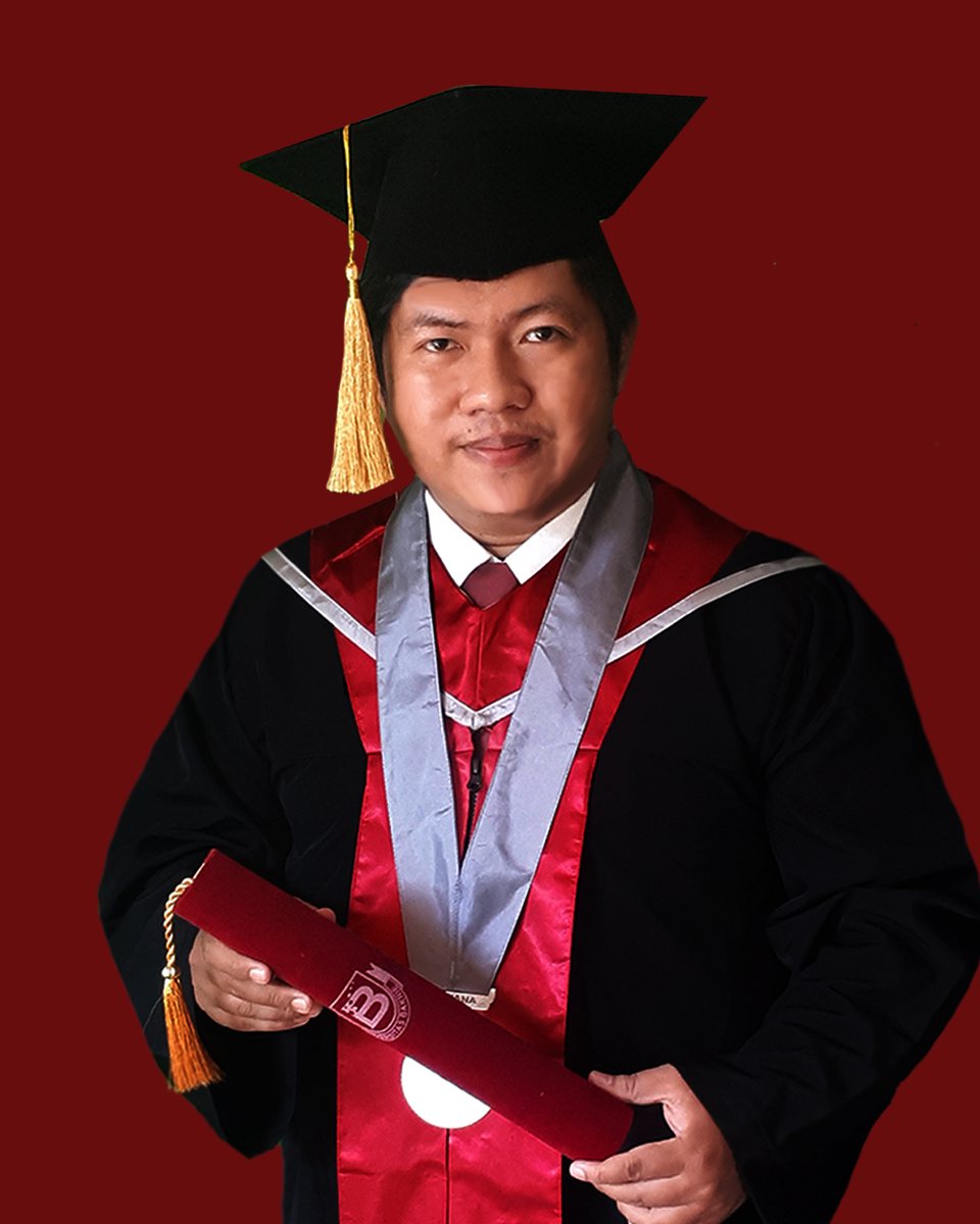 Riyan Al Fajri in academic cap and gown at his Universitas Bakrie graduation